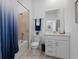 Well-lit bathroom featuring a shower-tub combo, a white vanity and sink, and modern fixtures at 17645 Boracay Ct # 202, Venice, FL 34293