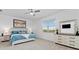 Tranquil bedroom features a large window and neutral decor at 17645 Boracay Ct # 202, Venice, FL 34293