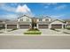 Charming townhome featuring an attached garage and manicured landscaping at 17645 Boracay Ct # 202, Venice, FL 34293