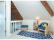 Cozy attic space with sloped ceilings and charming decor at 180 S Gulf Blvd, Placida, FL 33946