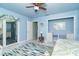 Serene bedroom with built-in desk, light walls, and natural light at 180 S Gulf Blvd, Placida, FL 33946