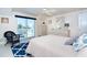 Bright, airy bedroom with white furniture and ocean view balcony at 180 S Gulf Blvd, Placida, FL 33946