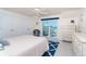 Bright bedroom with balcony and ocean views at 180 S Gulf Blvd, Placida, FL 33946