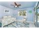 Bright bedroom with a colorful rug and access to the deck at 180 S Gulf Blvd, Placida, FL 33946
