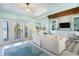 Cozy living room featuring hardwood floors, built-in shelving, and natural light at 180 S Gulf Blvd, Placida, FL 33946