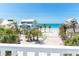 Stunning beach view from balcony showcasing the turquoise water and beachfront homes at 180 S Gulf Blvd, Placida, FL 33946