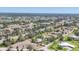 High-angle view of a residential area featuring attractive homes, a nearby waterway, and a well-manicured landscape at 20 Spaniards Rd, Placida, FL 33946