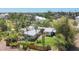 Aerial view of property showcasing the expansive backyard and tropical landscaping at 20 Spaniards Rd, Placida, FL 33946