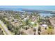 An aerial view of an island residential neighborhood showing houses and waterfront access at 20 Spaniards Rd, Placida, FL 33946