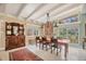 Open dining room featuring a large table, elegant sideboard and large windows at 20 Spaniards Rd, Placida, FL 33946