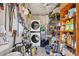 Efficient laundry room with stacked washer/dryer and ample storage for household supplies at 20 Spaniards Rd, Placida, FL 33946