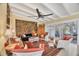 Bright living room features a ceiling fan, a tapestry, and comfortable seating with an outdoor view at 20 Spaniards Rd, Placida, FL 33946