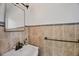 Cozy powder room with decorative tiling and a vintage-style sink and fixtures at 20 Spaniards Rd, Placida, FL 33946