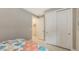 Neutral bedroom with a closet and comfortable bed, offering a tranquil retreat at 2117 Laurifolia Ct, North Port, FL 34289