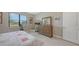 Neutral tone bedroom with natural light and furnishings, offering a soothing retreat with a view to the outdoors at 2117 Laurifolia Ct, North Port, FL 34289