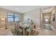Dining room featuring a decorative table set and a view into the home's entryway at 2117 Laurifolia Ct, North Port, FL 34289