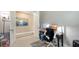 Home office area featuring a modern desk setup, artwork, and neutral décor at 2117 Laurifolia Ct, North Port, FL 34289