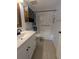 Bathroom with white vanity, tiled floors, and shower/tub combination at 25100 Sandhill Blvd # T101, Punta Gorda, FL 33983