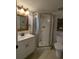 Updated bathroom featuring glass shower, and white sink and vanity at 25100 Sandhill Blvd # T101, Punta Gorda, FL 33983