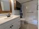Bathroom with white vanity, tiled floors, and shower/tub combination at 25100 Sandhill Blvd # T101, Punta Gorda, FL 33983