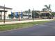 Community area with shade, seating and manicured lawn for outdoor enjoyment at 25100 Sandhill Blvd # T101, Punta Gorda, FL 33983