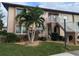 Charming two-story condo with well-manicured lawn and tropical landscaping at 25100 Sandhill Blvd # T101, Punta Gorda, FL 33983