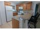 Kitchen features granite countertops, breakfast bar, and stainless appliances at 25100 Sandhill Blvd # T101, Punta Gorda, FL 33983