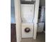 Efficient laundry setup with stackable washer and dryer conveniently located near the bathroom at 25100 Sandhill Blvd # T101, Punta Gorda, FL 33983