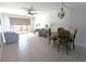 Bright and airy living room with tile floors and a view of the screened-in patio at 25100 Sandhill Blvd # T101, Punta Gorda, FL 33983