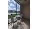 Enclosed patio featuring stylish tile flooring and a cozy seating area overlooking the water at 25100 Sandhill Blvd # T101, Punta Gorda, FL 33983
