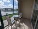Enclosed patio featuring stylish tile flooring and a cozy seating area overlooking the water at 25100 Sandhill Blvd # T101, Punta Gorda, FL 33983