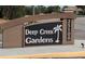 Entrance sign for Deep Creek Gardens at 25100, featuring a palm tree logo at 25100 Sandhill Blvd # T101, Punta Gorda, FL 33983