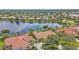 Stunning aerial view of the home and neighborhood, showcasing its position on a lake at 2669 Wax Myrtle Ct, Port Charlotte, FL 33953