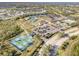 Aerial view featuring extensive community amenities including tennis and pickleball courts, pool, and clubhouse at 2669 Wax Myrtle Ct, Port Charlotte, FL 33953