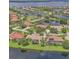 Gorgeous aerial view of the lakefront community, featuring beautiful homes and lush green landscaping at 2669 Wax Myrtle Ct, Port Charlotte, FL 33953