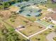 Aerial view of the community dog park with picnic tables and open space at 2669 Wax Myrtle Ct, Port Charlotte, FL 33953