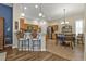 Inviting kitchen and dining area, featuring warm wood cabinets, stainless appliances, and a breakfast bar at 2669 Wax Myrtle Ct, Port Charlotte, FL 33953