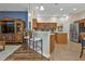 Open kitchen with stainless steel appliances, breakfast bar, and tile flooring at 2669 Wax Myrtle Ct, Port Charlotte, FL 33953