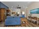Cozy living room with blue couches, hardwood floors, and an entertainment center at 2669 Wax Myrtle Ct, Port Charlotte, FL 33953