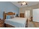 Comfortable bedroom with a wooden bed frame and blue accents at 2669 Wax Myrtle Ct, Port Charlotte, FL 33953