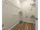 Spacious walk-in closet with ample shelving and modern wood-look flooring at 2669 Wax Myrtle Ct, Port Charlotte, FL 33953