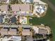 Aerial view of the property showcasing its proximity to the waterfront, community pool, and boat slips at 2769 N Beach Rd # 105, Englewood, FL 34223
