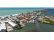 Aerial view of the property showcasing its proximity to the waterfront, community pool, and boat slips at 2769 N Beach Rd # 105, Englewood, FL 34223
