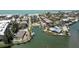 Aerial view highlighting the canal-front location, docks, and community pool at 2769 N Beach Rd # 105, Englewood, FL 34223