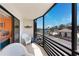 Screened in balcony offering seating and pretty street and water views at 2769 N Beach Rd # 105, Englewood, FL 34223
