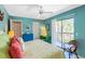 The main bedroom boasts a ceiling fan, a large closet, and a private balcony at 2769 N Beach Rd # 105, Englewood, FL 34223