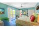 Cozy main bedroom with a sliding glass door leading to a private balcony at 2769 N Beach Rd # 105, Englewood, FL 34223