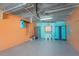 Spacious garage featuring painted walls, epoxy flooring, and ample storage for beach gear and recreational equipment at 2769 N Beach Rd # 105, Englewood, FL 34223