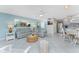 Comfortable living room with neutral tones, ceiling fan, and tile floors at 2769 N Beach Rd # 105, Englewood, FL 34223