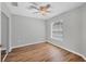 Bedroom with a ceiling fan and wood floors at 2821 Embassy Rd, North Port, FL 34291